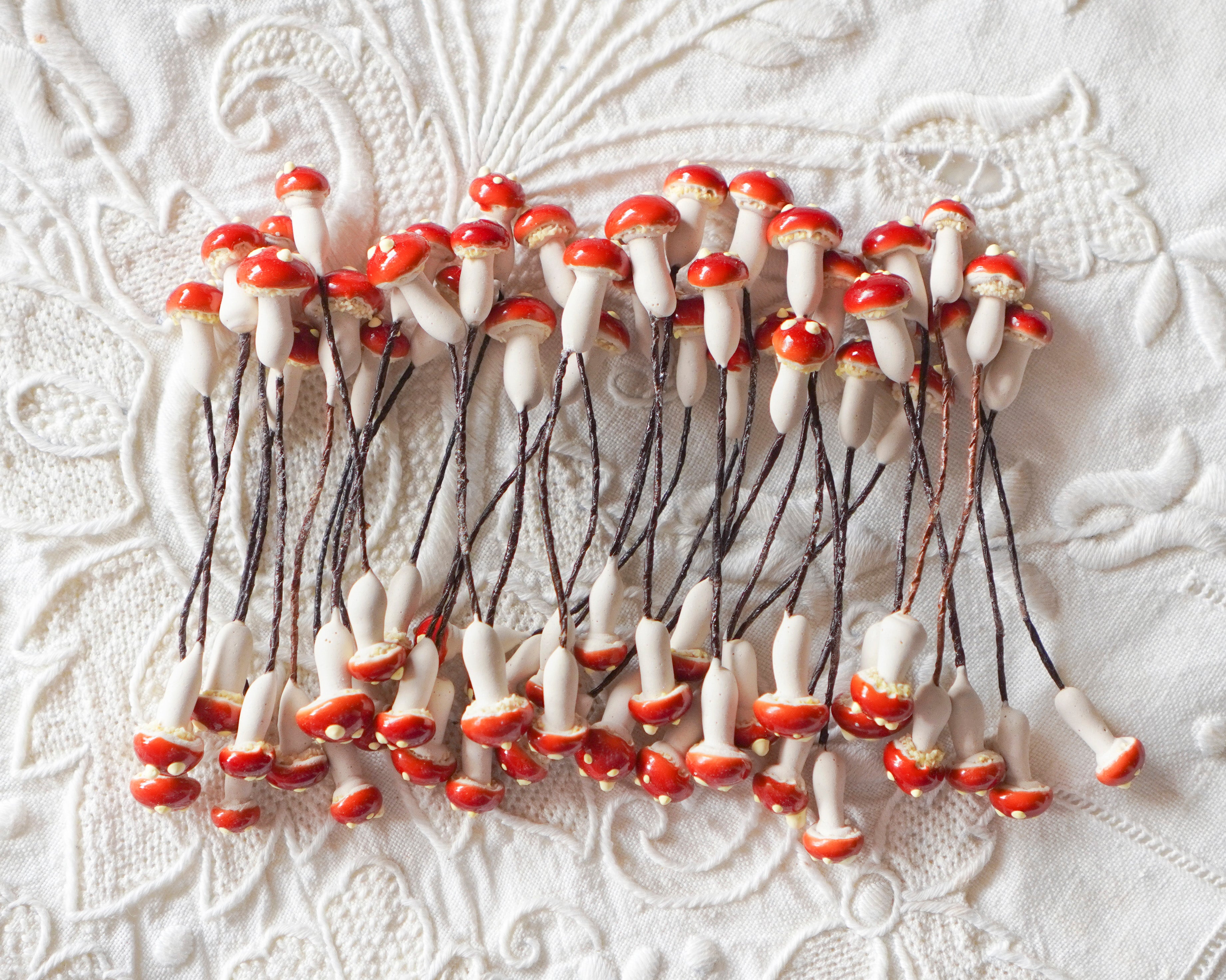 Tiny craft mushrooms on a white background.