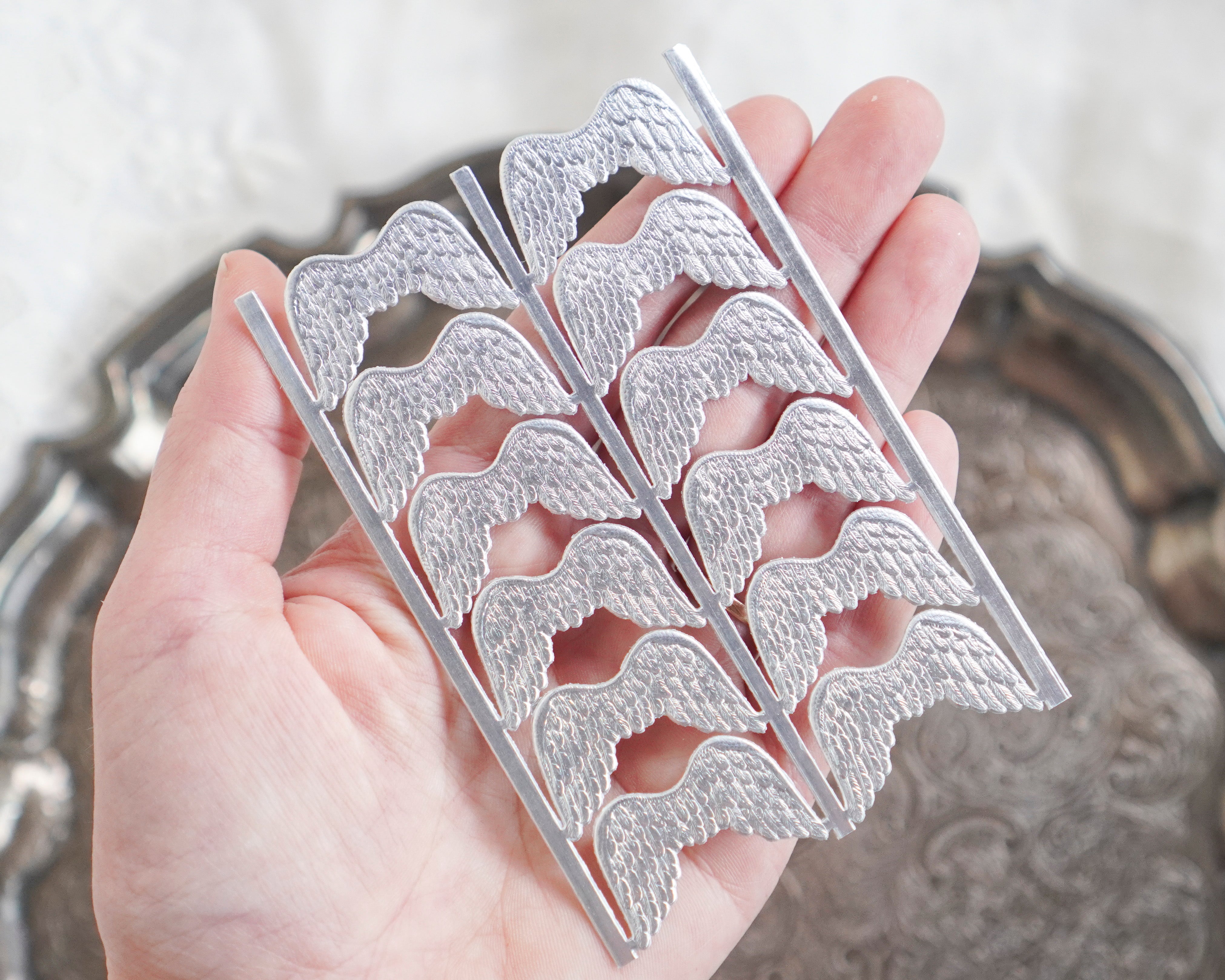 Mini Angel Wings - Tiny Embossed Silver Foil Die Cut Dresden Paper Wings, 12 Pcs.