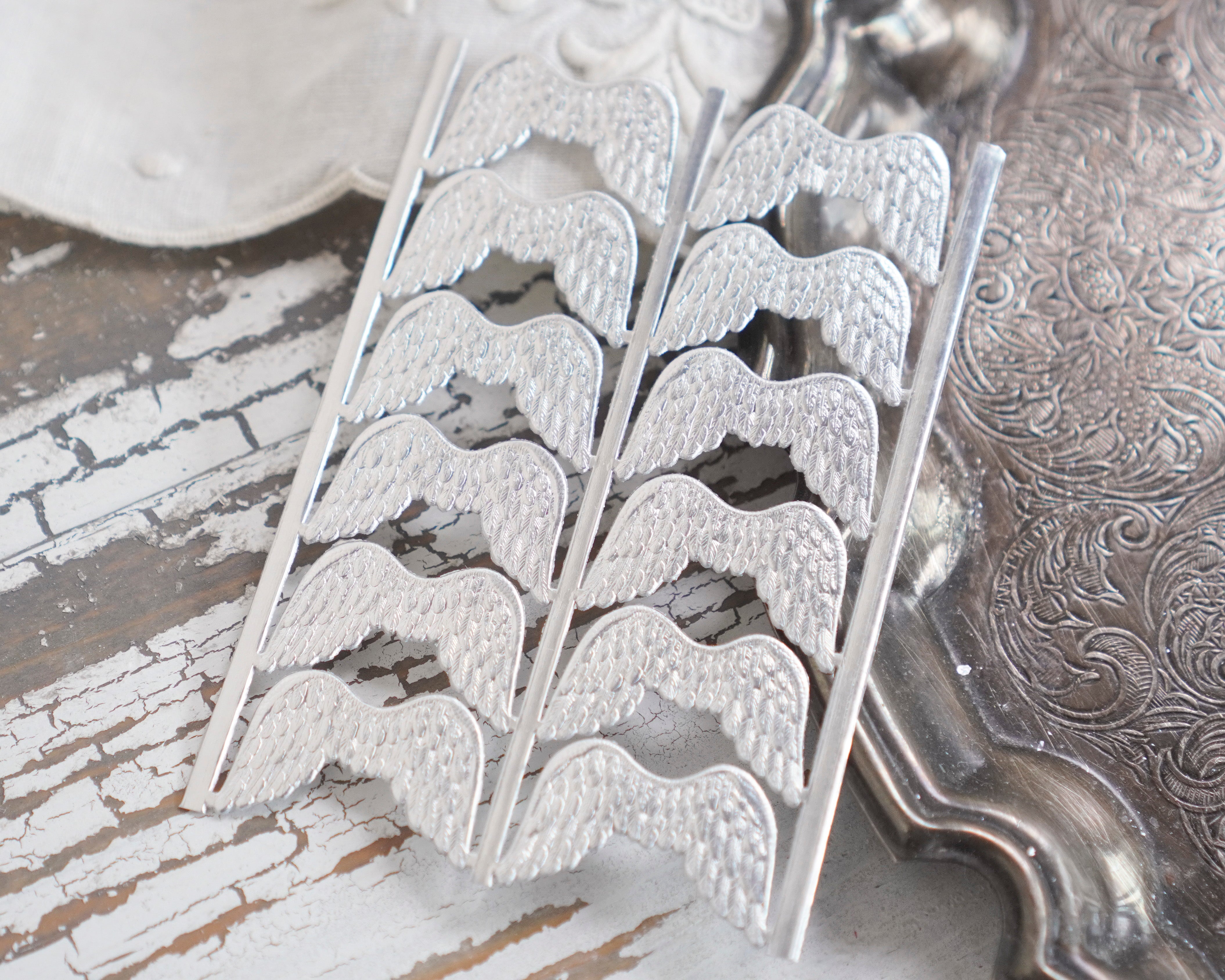 Mini Angel Wings - Tiny Embossed Silver Foil Die Cut Dresden Paper Wings, 12 Pcs.